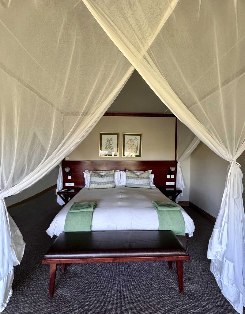 Bedroom with garden views at Ilala Lodge