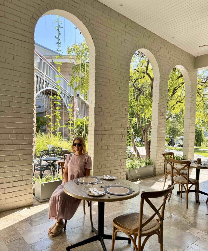 Elegant dining area at The Palm River Hotel with timber and corrugated iron design